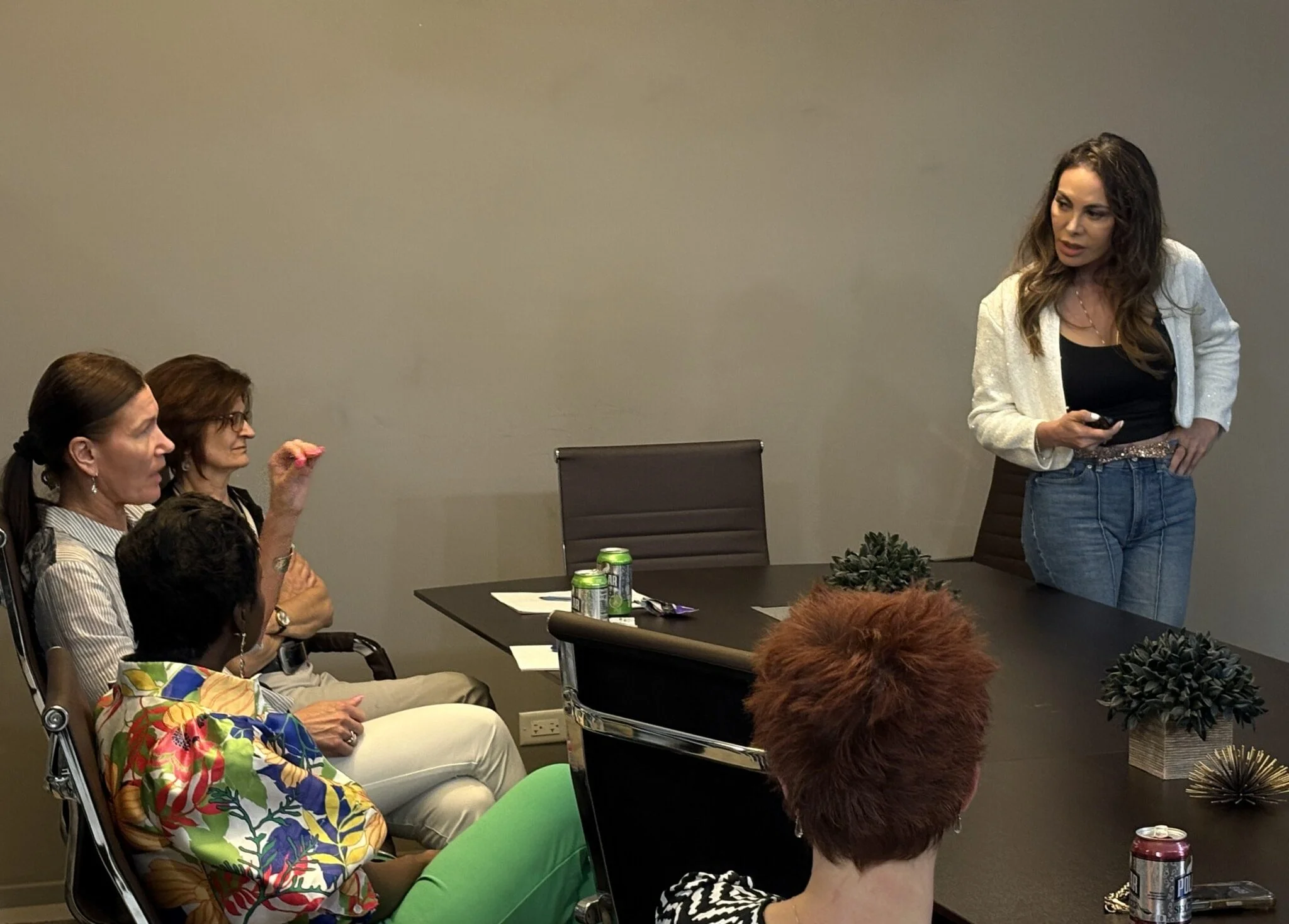 Diverse women collaborating and sharing ideas during a business networking event hosted by the brand sheowns.